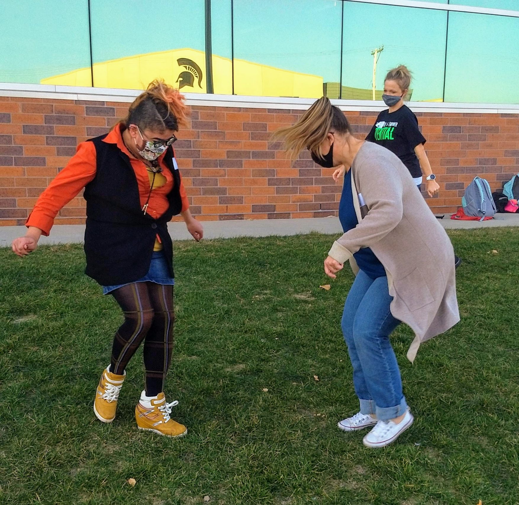 A pair of club members play a socially distanced game of foot tag